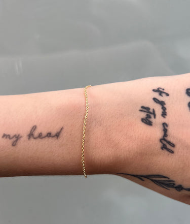 diamond cut square gold cable chain on wrist