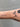 Gold chain with oval shaped links on wristt
