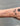 Dainty gold cable chain on a wrist