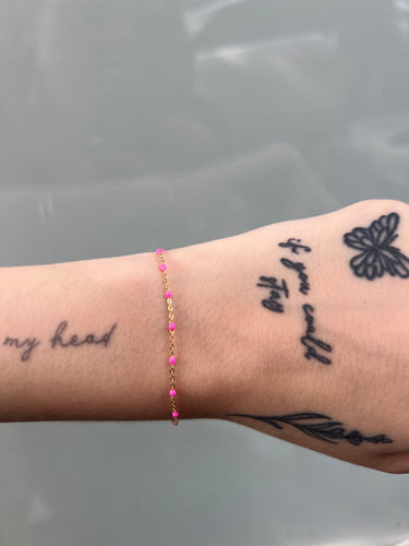 14k gold cable chain with pink enamel beads on wrist