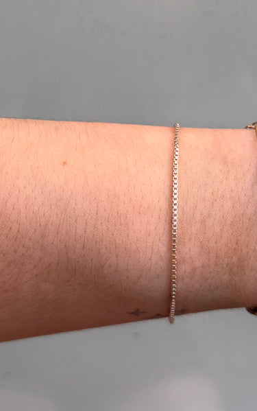 Silver box chain on wrist