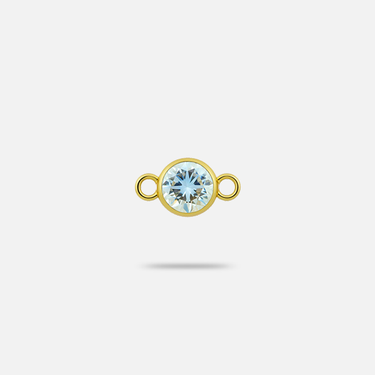 Small connector charm with round, faceted, clear aquamarine gem in yellow gold.