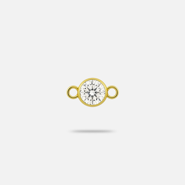 A smaller natural diamond charm encased with yellow gold