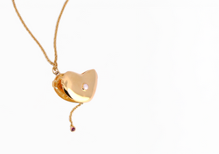 Heart of Grace: A Locket Necklace That Balances Softness and Strength