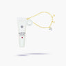 White lip balm tube with gold chain and decorative elements on a white background