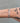 Thick silver curb chain on wrist