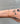 long paperclip link gold chain on wrist