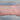 Silver chain on a person's wrist on a white background
