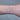 Silver chain with blue beads on a person's wrist 