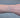 Silver chain with blue beads on a person's wrist 