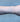 Silver chain with blue beads on a person's wrist 