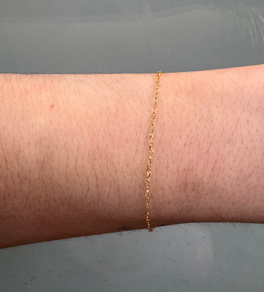 Heart shaped link chain on a wrist