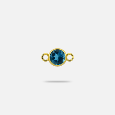 Small connector charm in yellow gold with faceted, round blue topaz.