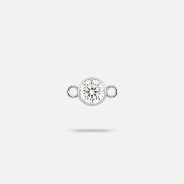A natural diamond charm encased with white gold