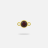 A small yellow gold connector charm with a round, faceted 3.4mm garnet.