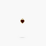 A heart shaped garnet stone encased with yellow gold