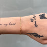 Gold-filled paperclip link chain on wrist