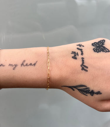 Gold-filled paperclip link chain on wrist