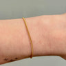 gold filled thin curb chain on wrist
