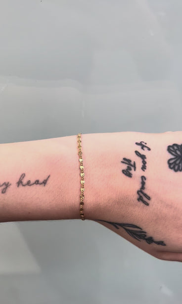 starburst link flat gold filled chain on wrist