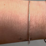 Silver box chain on wrist