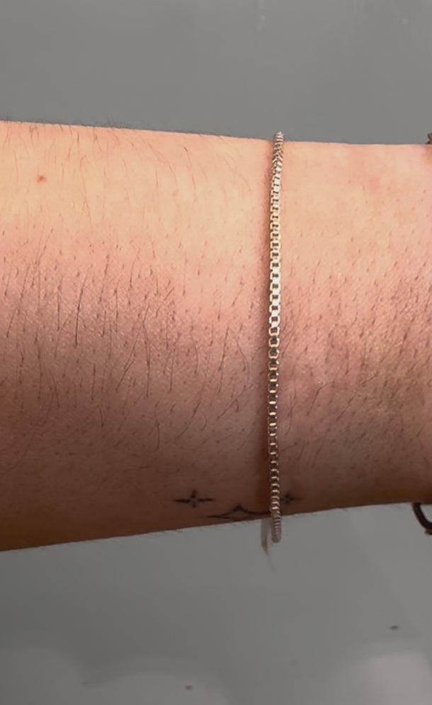 Silver box chain on wrist