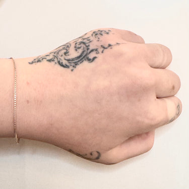Slim cubic box links in sterling silver on model hand